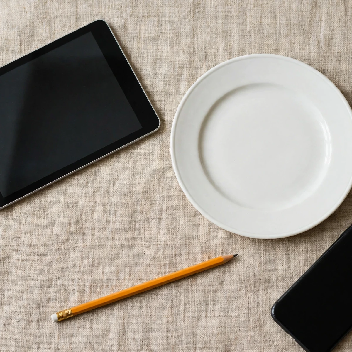 Everyday objects around 8 inches, including a tablet and a plate